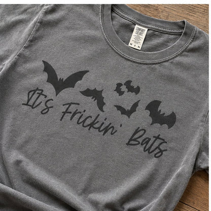 Close-up of the "It's Frickin' Bats" graphic showing the black bat cluster and cursive lettering printed on heathered grey cotton fabric.