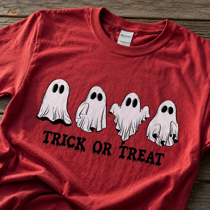 Close-up of the four hand-drawn ghosts and dripping "TRICK OR TREAT" text printed on red cotton fabric.