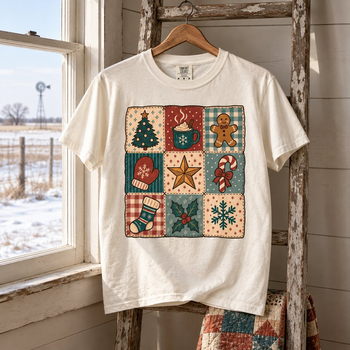 Vintage Christmas patchwork tee hanging on a wooden ladder beside a frosty window with a folded quilt below